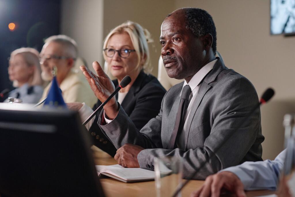 Businessman speaking his speech in microphone
