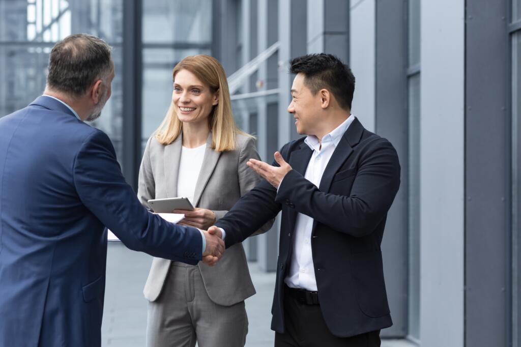 Three experienced managers team leaders, meet and get to know from outside the office team, diverse